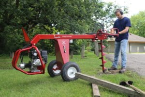 Towable hydraulic earth auger